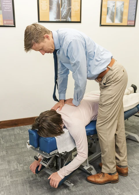 Dr. Spencer Wade during a back adjustment session.